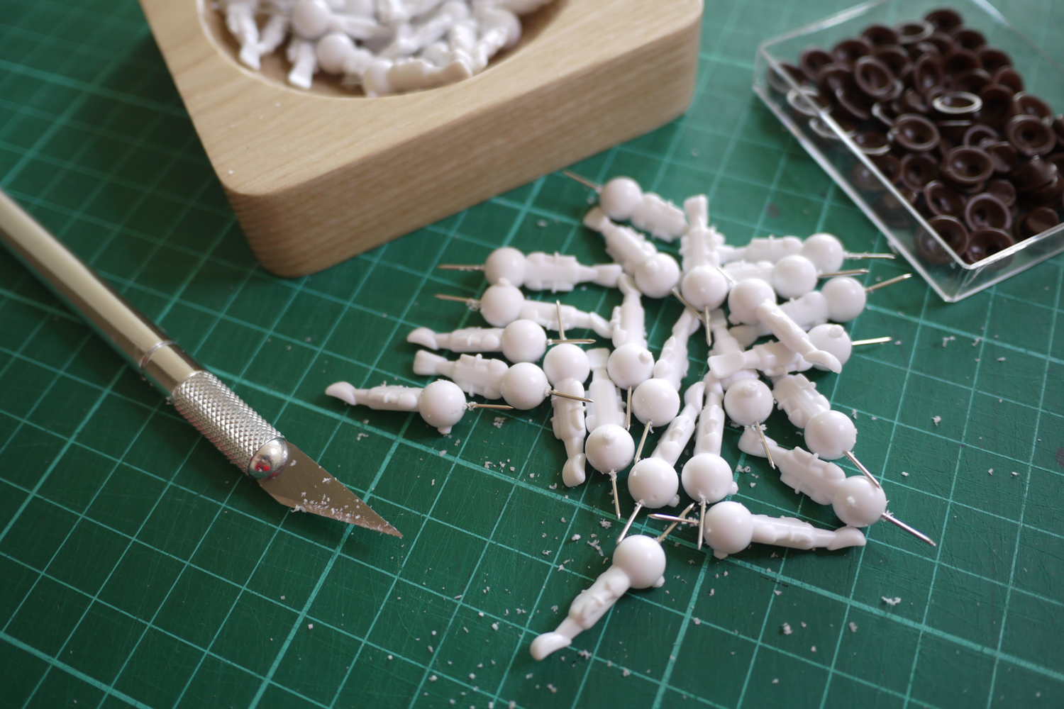 small batch manufacture photo showing mid process of scraping witness lines from injection mouldings