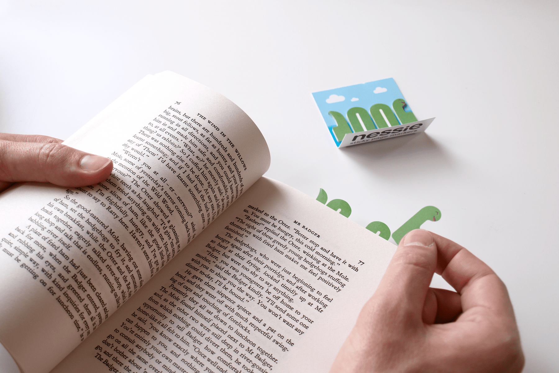 Nessie head being stuck in the page of a paperback book