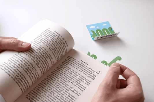 Nessie head being stuck in the page of a paperback book