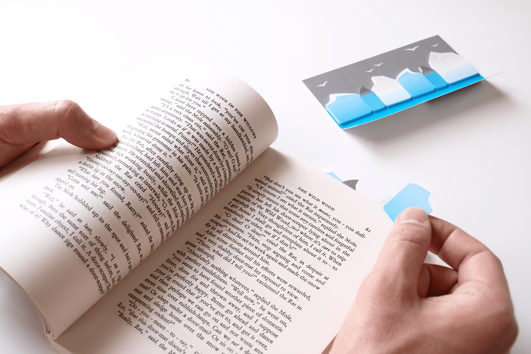 Wave paper book tab being placed in a page of a book