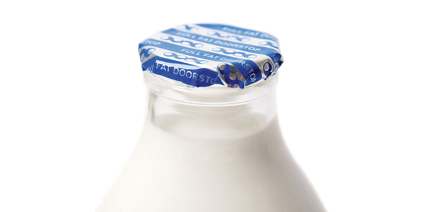 milk blue bottle foil cover which reads "FULL FAT DOORSTOP"
