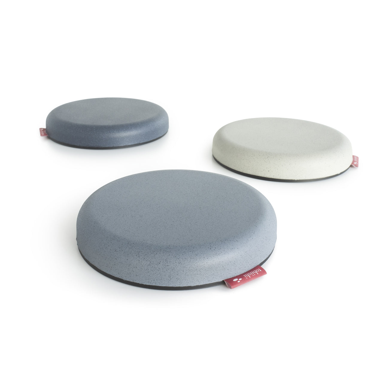 side view of three tobiishi (stepping stones) in different colours - grey, light grey and stone.