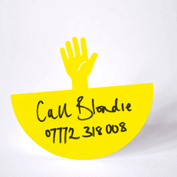 paper yellow hand waving from side to side in a gentle motion on it's rounded base