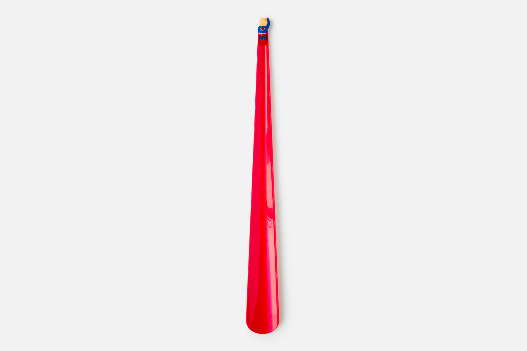A long red cape forms the functional part of the shoehorn design, whilst a minature superhero is affixed to the top to add humor and delight to the user experience