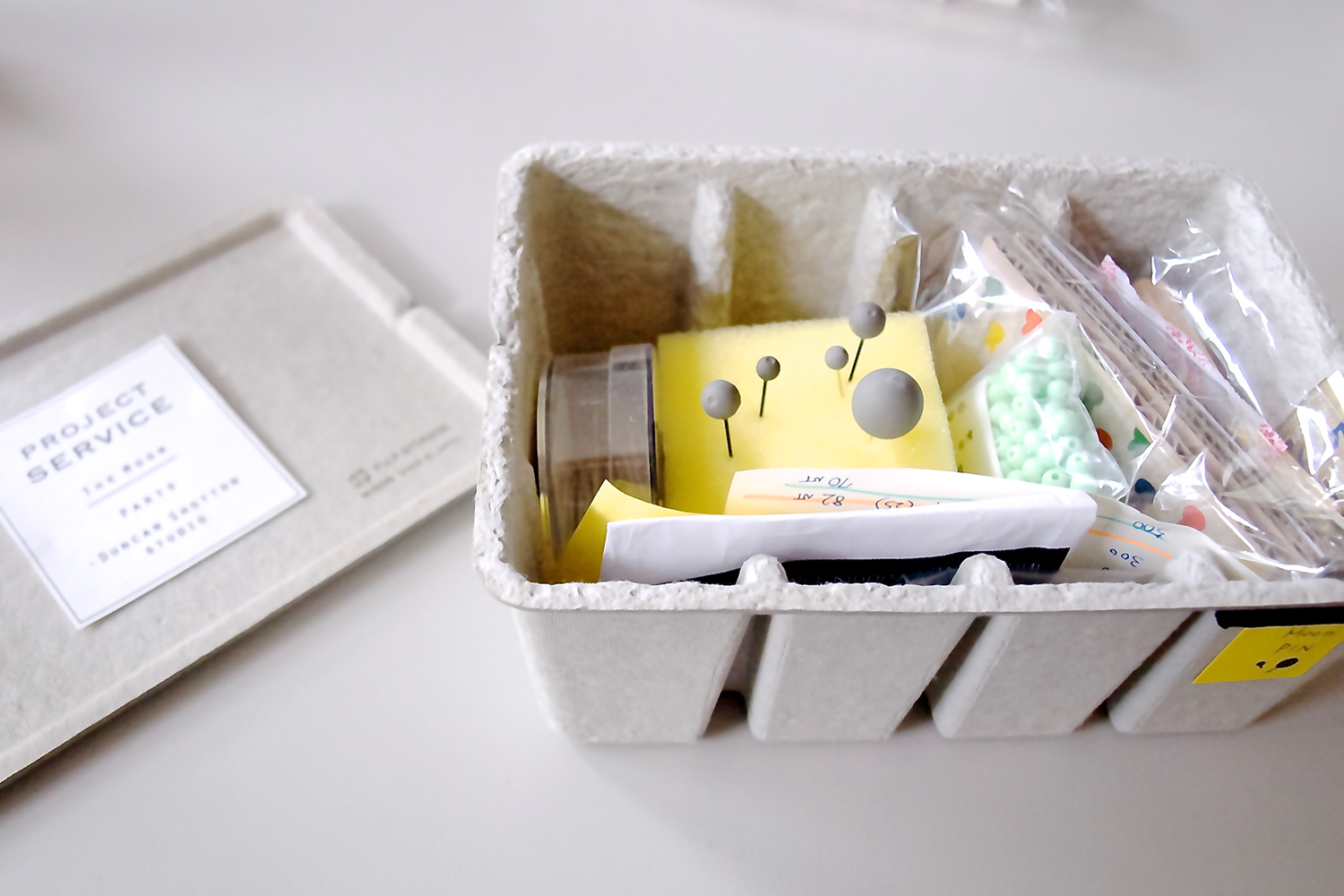 fine concrete product development process in a project box featuring lots of prototypes and samples