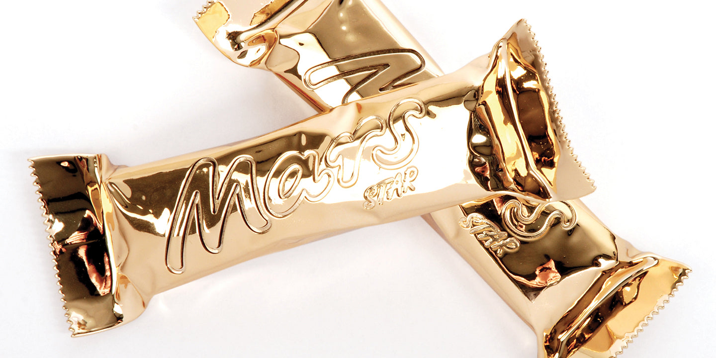 Model of two Mars bars in their wrapper, appearing to be solid, shiny gold